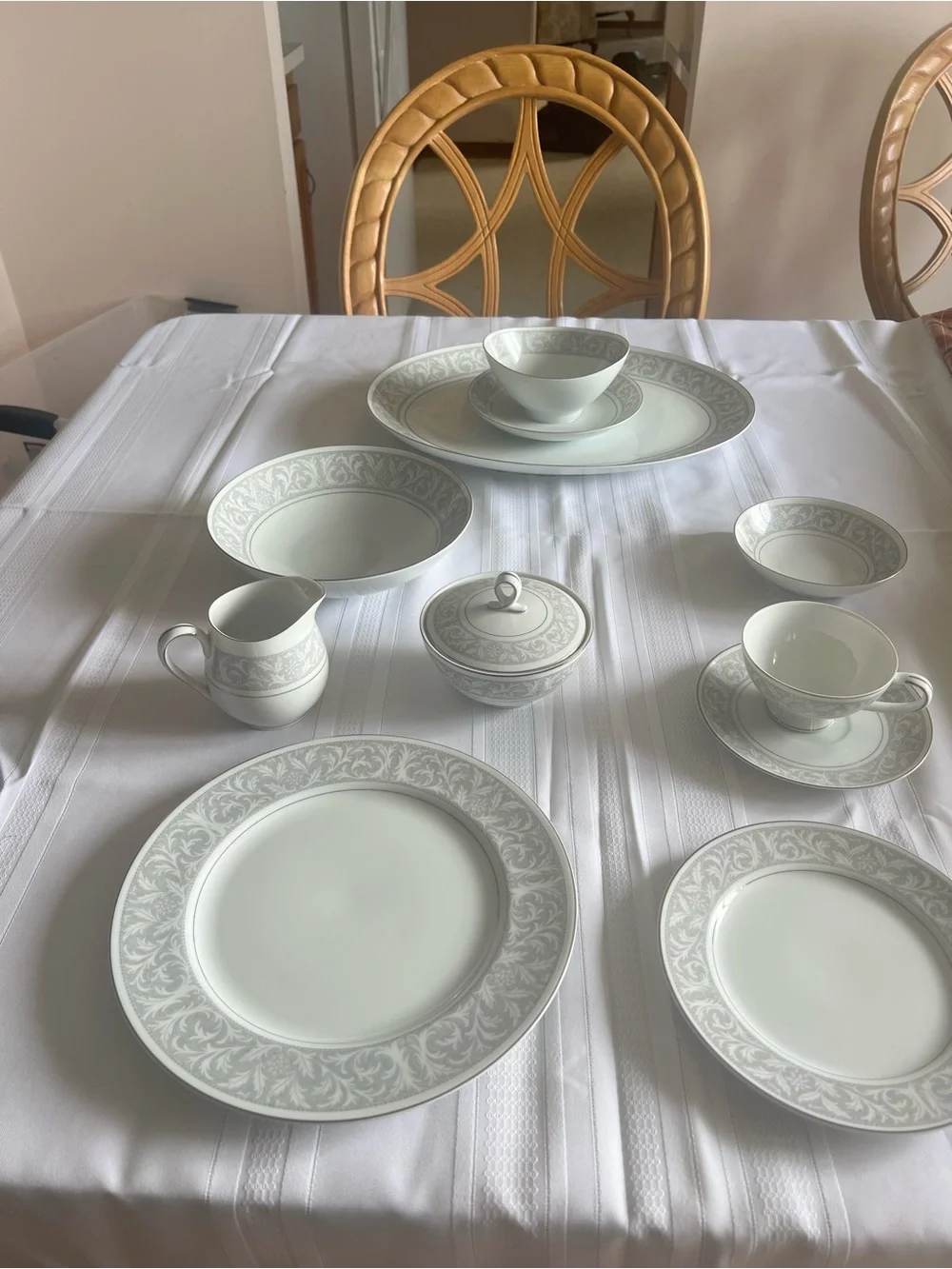 Elegant White and Silver Dinnerware Set with Delicate Scroll Border